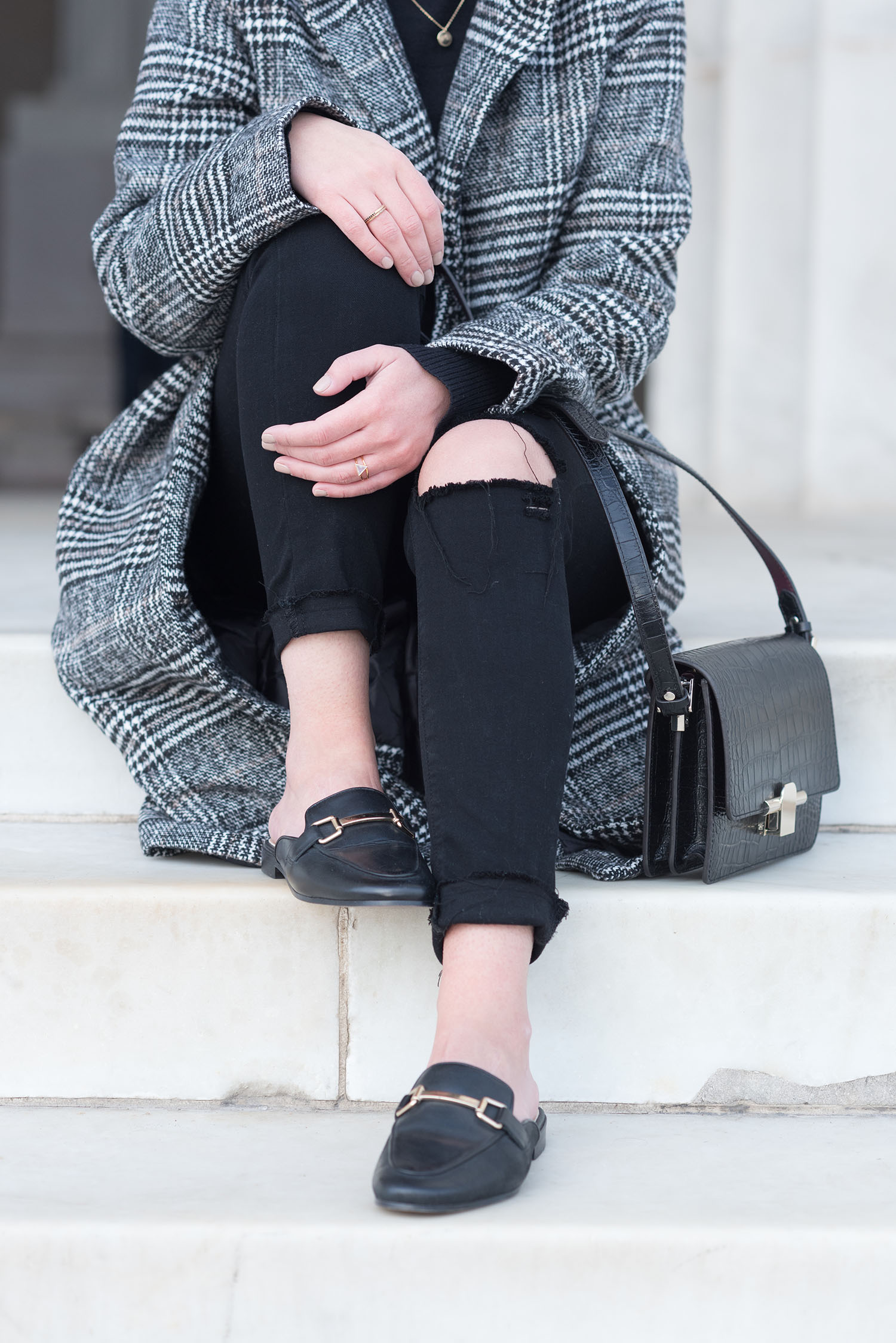 Outfit details on fashion blogger Cee Fardoe of Coco & Vera, including Jonack mules and Paige black jeans