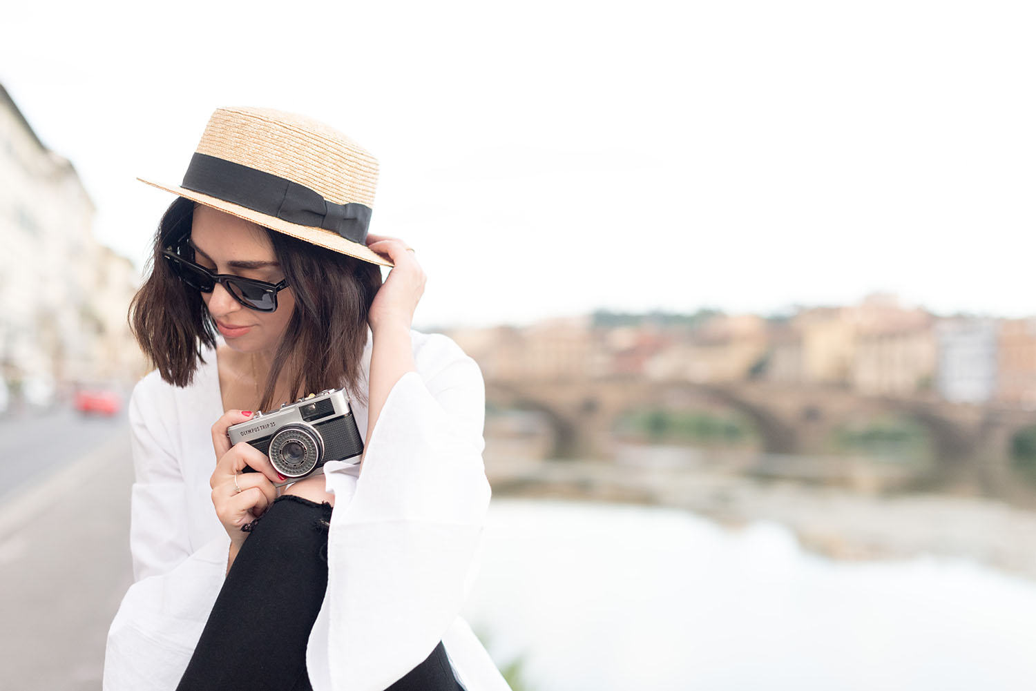 Portrait of top Winnipeg fashion blogger Cee Fardoe of Coco & Vera wearing a white L'Academie top and RayBan Wayfarer sunglasses