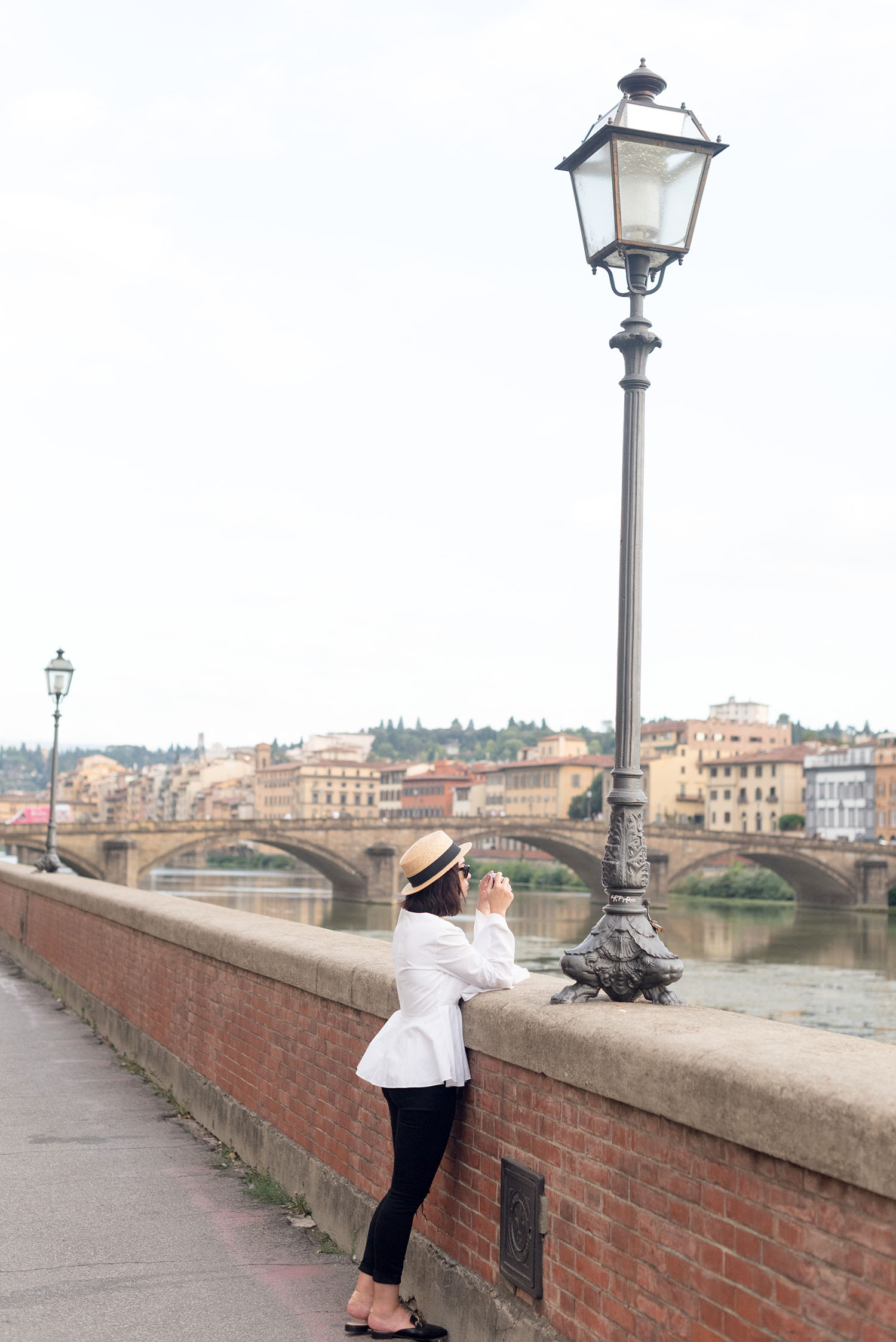 Top Canadian fashion blogger Cee Fardoe of Coco & Vera wears a L'Academie white blouse and black Paige jeans in Florence, Italy